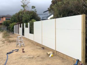 Sound barrier fence between houses